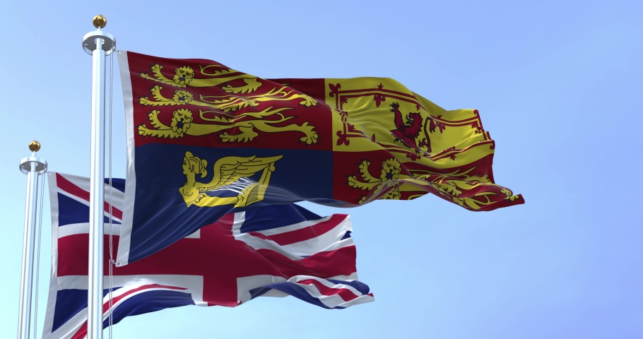 London, UK, September 2022: The Royal Standard of the United Kingdom waving the wind along with the UK flag. Seamless loop in slow motion Royalty-Free Stock Footage #1094370637