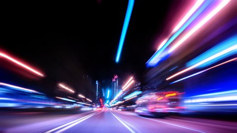 Timelapse of a high speed night city drive in the city downtown, Driving Timelapse Night view from the car window to the road, night rush drive highway with a lot of colorful lights and trails. ஸ்டாக் வீடியோ