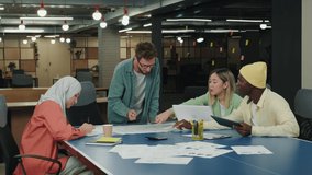 Male Caucasian leader discusses a project with his colleagues.Different Races,Diverse People,Creative Team,Business Partners - Powered by Shutterstock - Get 15% off with code: PIKWIZARD15