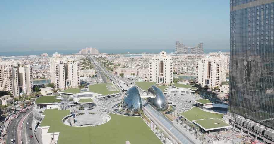 Central location on Dubai's The Palm Jumeirah, showing the metro tram line running down the middle of this man made marvel of engineering in the UAE desert. Royalty-Free Stock Footage #1094382069