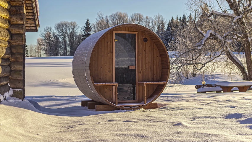 Timelapse: Wooden modular cabin room at a snow covered lake side forest area. Eco tourism concept
