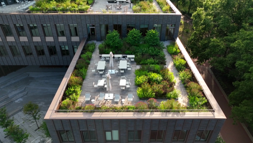 Health outdoor city living. Rooftop garden and seating areas with green plants growing in American city. USA Charlottesville Virginia. | Shutterstock HD Video #1094385077