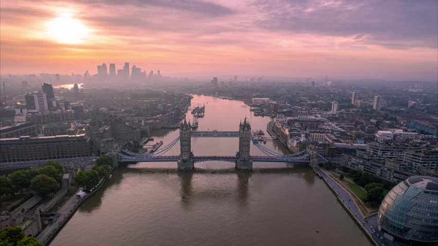 Golden Hour Sunrise Over Tower Bridge On River Thames In London. Drone over great britain, UK Famous Landmarks On The Riverbanks. aerial hyperlapse in England Royalty-Free Stock Footage #1094385639