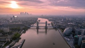 Golden Hour Sunrise Over Tower Bridge On River Thames In London. Drone over great britain, UK Famous Landmarks On The Riverbanks. aerial hyperlapse in England - Powered by Shutterstock - Get 15% off with code: PIKWIZARD15