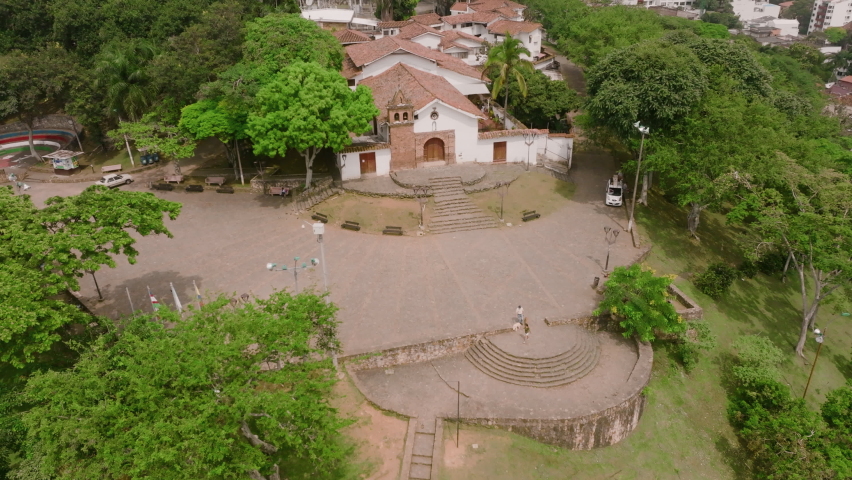 Aerial footage pulling out away from a church in the city of Cali, Colombia.