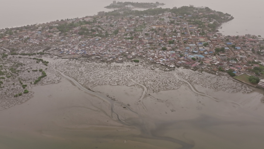 Wide panning aerial footage showing the riverlets in the bay outside of Freetown, Sierra Leone.