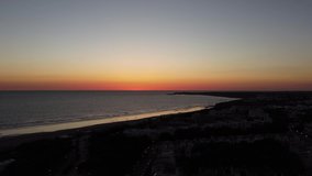 4k drone panning of coastline at sunset