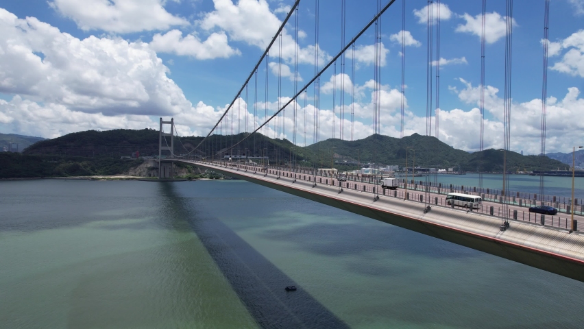 Aerial Highway Flyover Traffic on Ma Wan in Hong Kong Tsing Ma suspension Bridge, Ting Kau bridge Royalty-Free Stock Footage #1094402211