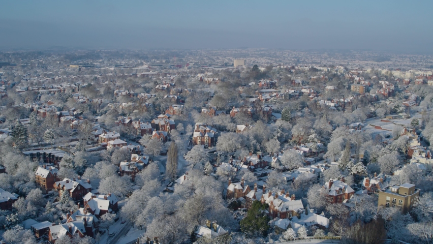 Aerial establishing shot of Nottingham england covered in snow