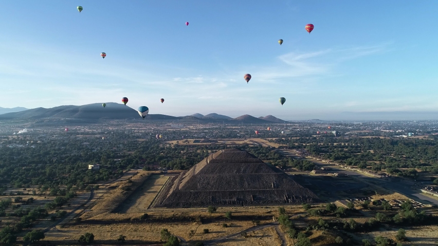 Tourists ballooning above the Pyramid of the sun, in sunny Teotihuacan, Mexico - Aerial view