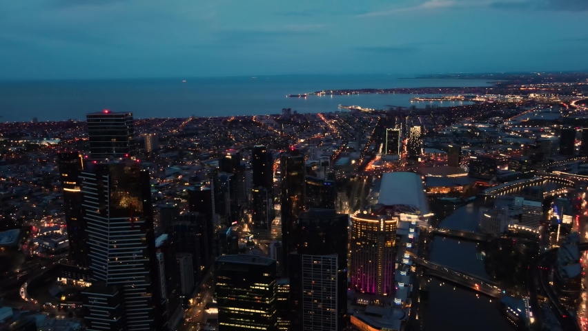 Beautiful aerial drone view of Melbourne City, Victoria, Australia looking over Yarra River in the very early morning at dawn 