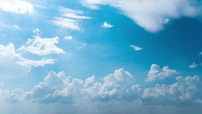 White fluffy clouds slowly float through the blue daytime sky timelapse. Beautiful skies are moving. Airy snow-white clouds move to the side. - Powered by Shutterstock - Get 15% off with code: PIKWIZARD15