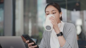 Bring your own cup glass in zero waste eco friendly cafes. Asia smart adult people city life work hybrid workplace office drink hot mug tea coffee bottle sit relax easy in shop look read mobile news. - Powered by Shutterstock - Get 15% off with code: PIKWIZARD15