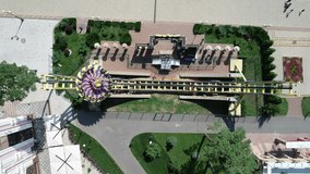 Ferris wheel in Gorky Central Park of Culture and Leisure in Kharkov aerial view. Ukraine. Drone video. Summer. 