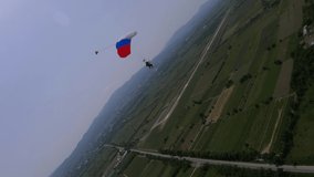 tandem parachute is landing, cloudy weather