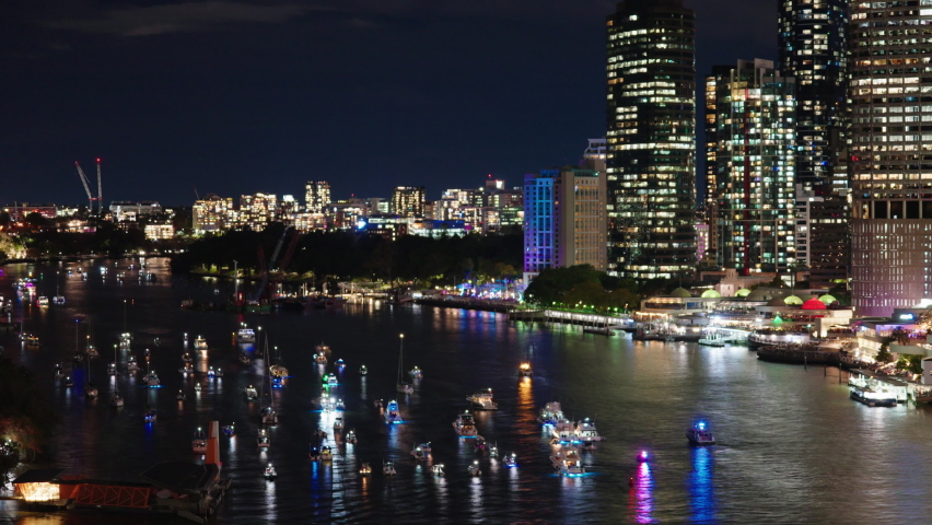 Timelapse Of Light Up Boats On Brisbane River During Riverfire Festival With Bright Cityscape, 4K