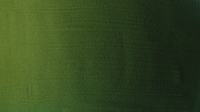 Hand drawing the Infinity symbol in the Green Sand. Male hand writes the Infinity symbol on the green sand with white backlight. Top view 4k resolution