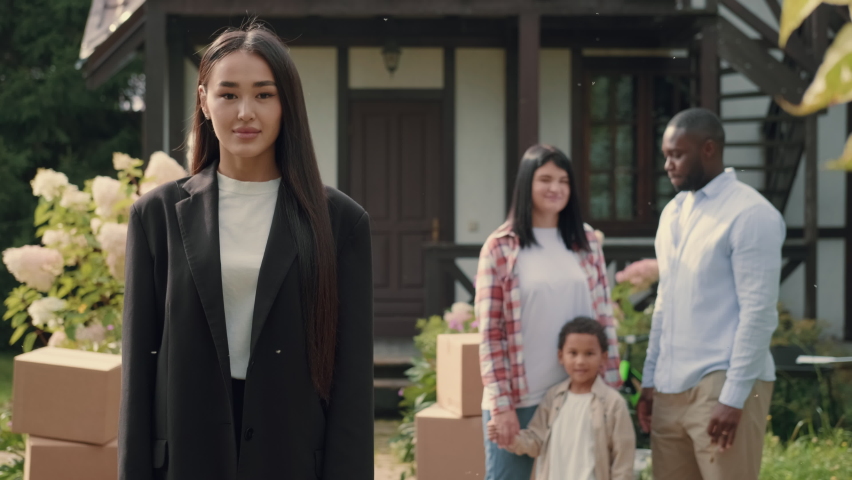 Portrait of a successful Asian female real estate agent who made a successful deal.Multiracial Family,Mixed Race,Diverse People,Multiethnic Relations Royalty-Free Stock Footage #1094438153