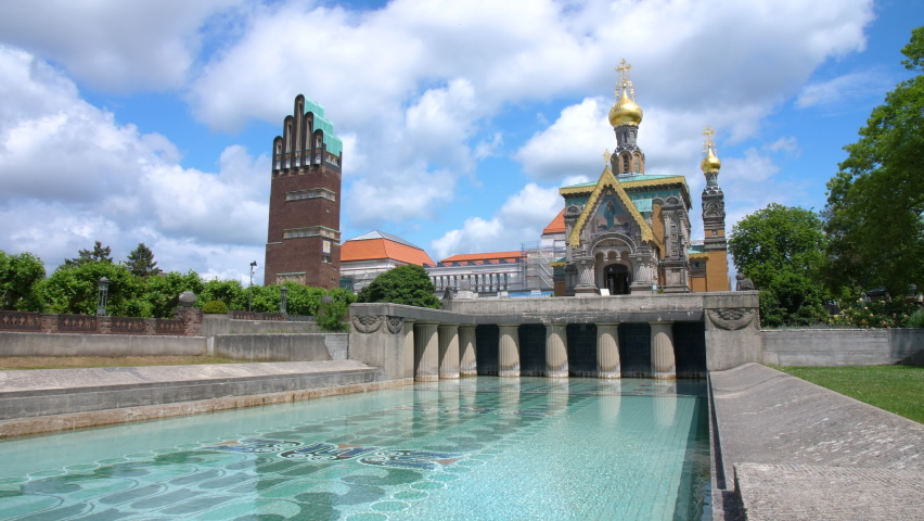 Mathildenhoehe russian orthodox chapel Darmstadt with Hochzeitsturm wedding tower and fountain art nouveau steady wide angle gimbal shot 4k on a sunny day clouds blue sky