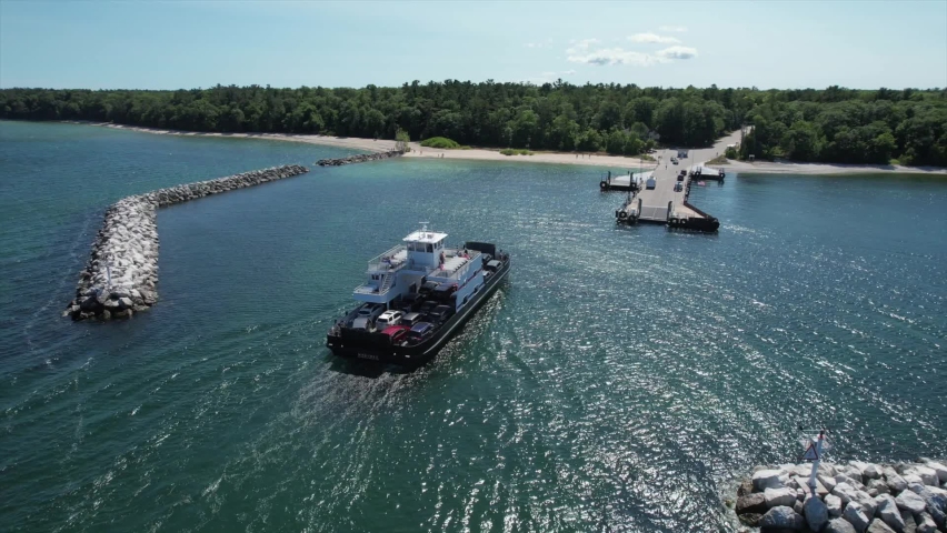 The Washington Island Car Ferry approaches the pier at Northport, Wisconsin located on the far north shore of the Door County Peninsula located between Lake Michigan and the bay of Green Bay.