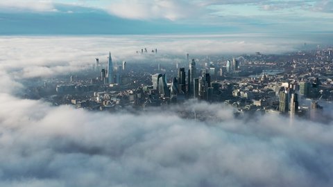Establishment Aerial view of London clouds and fog with Tower Bridge, sky garden, The Shard, Thames River, London Eye, The Gherkin, Cityscape and Iconic commercial Skyscrapers. United Kingdom: film stockowy