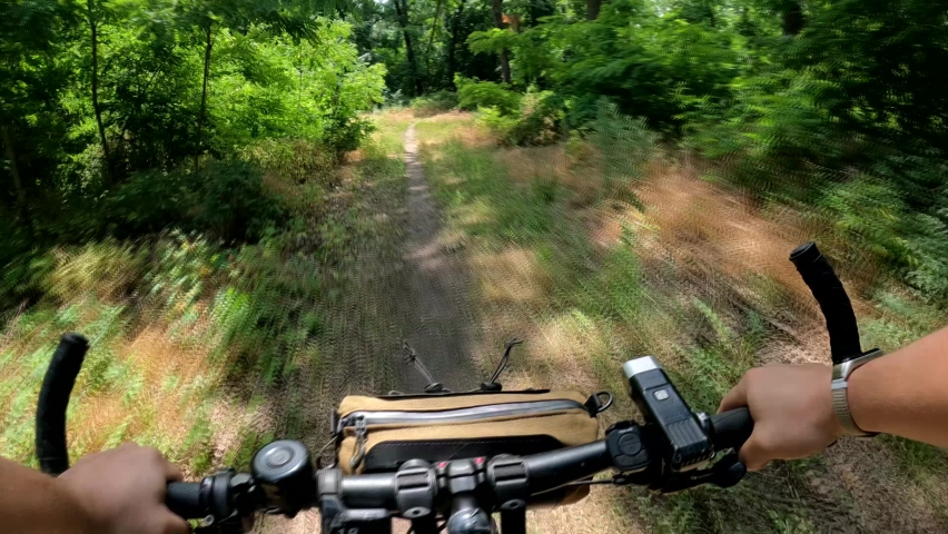 Ride an electric bike. Steering wheel first person view. Riding POV | Shutterstock HD Video #1094456339