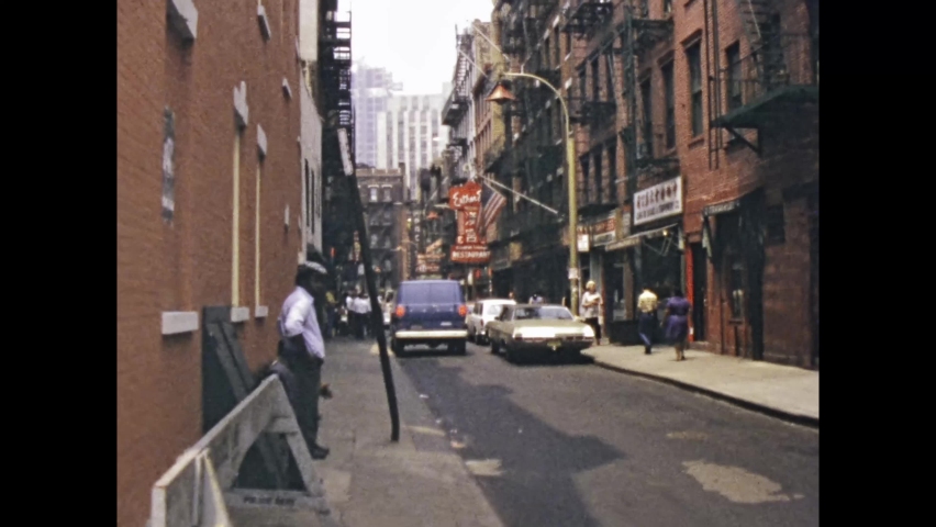 New York, United States may 1975: Busy street with traffic and tourists walking in New York in 70s