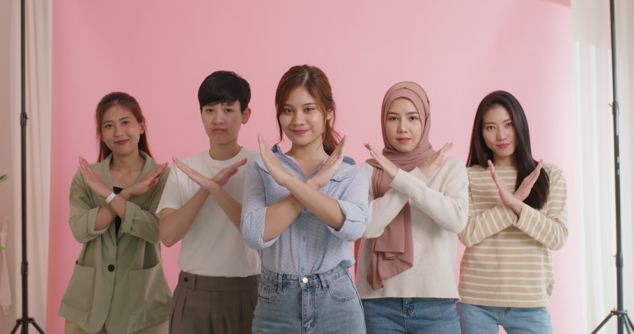 Diverse group of asia Gen z girl arm cross break the bias happy face look at camera in model shooting studio shot. Power of woman's day right or gay youth LGBT pride unity team strong cool proud smile | Shutterstock HD Video #1094458975