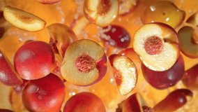 Super Slow Motion Shot of Peach Cuts And Water Flying Towards Camera on Orange at 1000 fps. - Powered by Shutterstock - Get 15% off with code: PIKWIZARD15