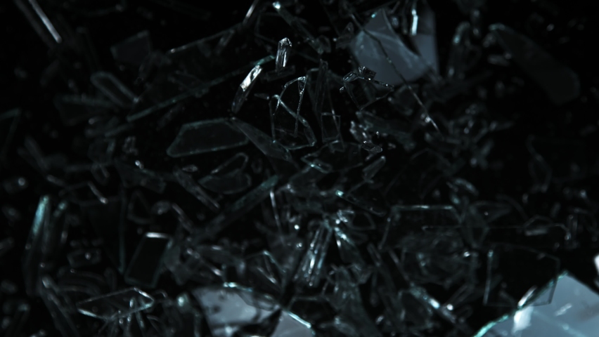 Super Slow Motion Shot of Glass Shards Flying Towards Camera Isolated on Black at 1000fps. | Shutterstock HD Video #1094469241