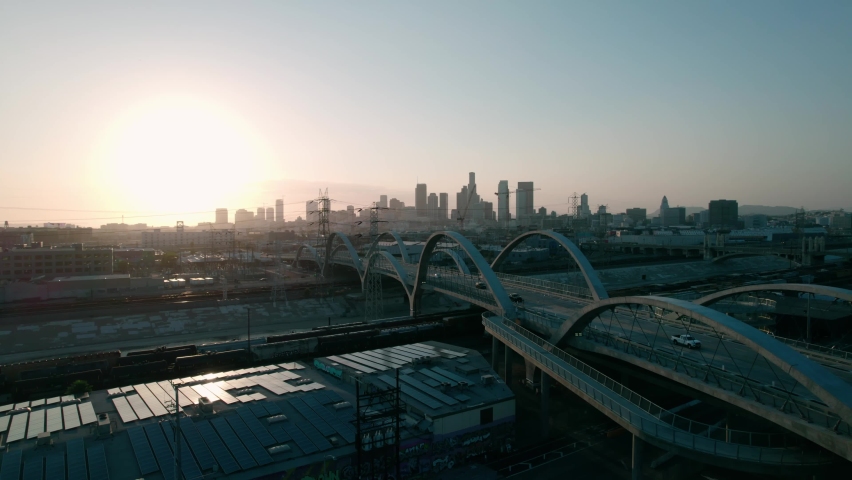 Los Angeles, California. 6th Street Bridge in Los Angeles at Sunset with the Downtown Los Angles. Drone Aerial View. 4K UHD.