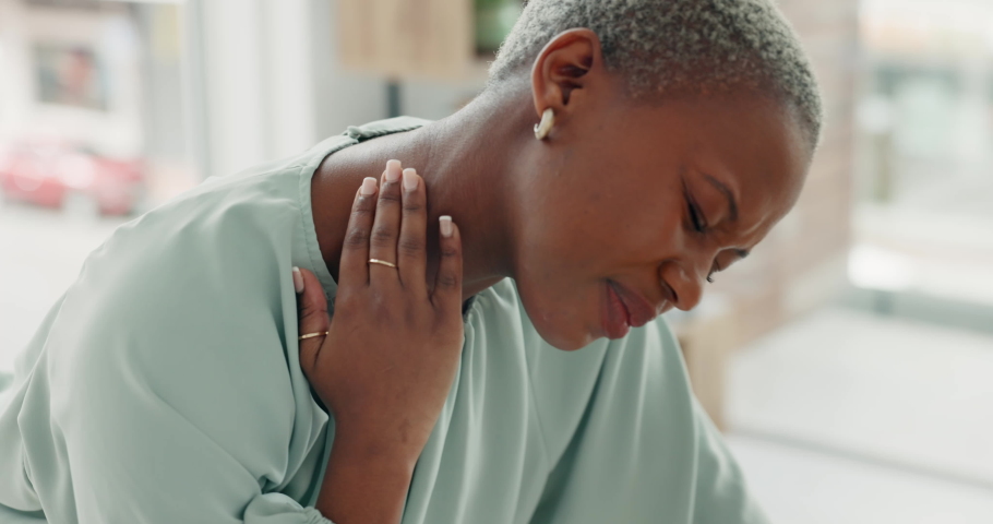 Neck, medical and healthcare with a black woman in pain, rubbing an injury with her hand inside. Anatomy, accident and muscle inflammation with an african american female feeling hurt or sore Royalty-Free Stock Footage #1094472153
