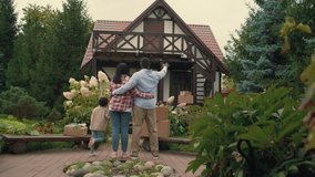 Multi-ethnic family look at a bought new house. African dad, Caucasian mom, african son.Multiracial Family,Mixed Race,Diverse People,Multiethnic Relations,BIPOC - Powered by Shutterstock - Get 15% off with code: PIKWIZARD15