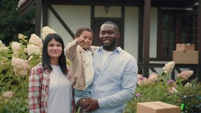 Portrait of a multi-ethnic family with keys who bought a new house. African dad, Caucasian mom, african son.Multiracial Family,Mixed Race,Diverse People,Multiethnic Relations - Powered by Shutterstock - Get 15% off with code: PIKWIZARD15