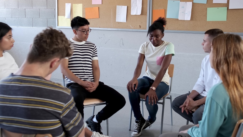 Teen black female talking about struggles in group therapy. Teen hispanic boy showing support. Mental health. 4k video. | Shutterstock HD Video #1094474503