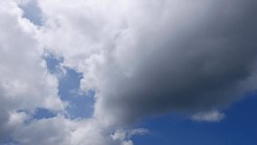 Blue sky white clouds. Puffy fluffy white clouds. Cumulus cloud scape timelapse. Summer blue sky time lapse. Dramatic majestic amazing blue sky. Soft white clouds form. Clouds time lapse background