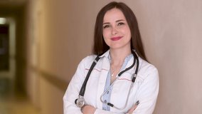 Portrait of smiling female doctor in medical Uniform standing in hospital corridor looking at camera with stethoscope. Health care and medical concept. Medical workers. - Powered by Shutterstock - Get 15% off with code: PIKWIZARD15