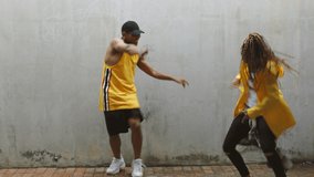Man dance with black woman, recording hip hop video or social media post. Young African dancers with lady shooting on phone camera, show body movement to music for people watching on internet or tv
