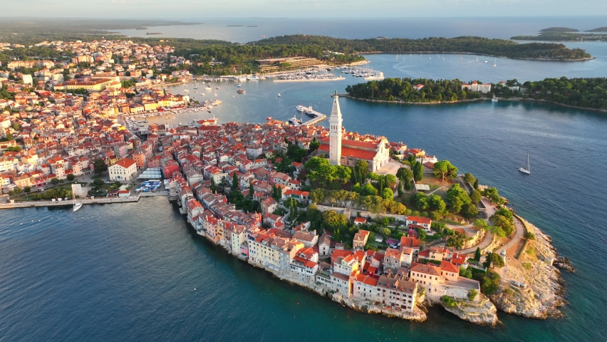 Sunset aerial panorama of old town Rovinj, famous ancient Croatian city at the sea. Istria, Croatia. Royalty-Free Stock Footage #1094484185