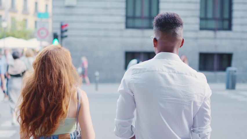 Group of friends crossing the pedestrian crossing