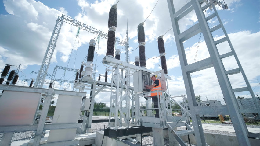 Electrical engineers inspect the electrical systems at the equipment control cabinet