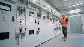 Electrical engineers inspect the electrical systems at the equipment control cabinet - Powered by Shutterstock - Get 15% off with code: PIKWIZARD15