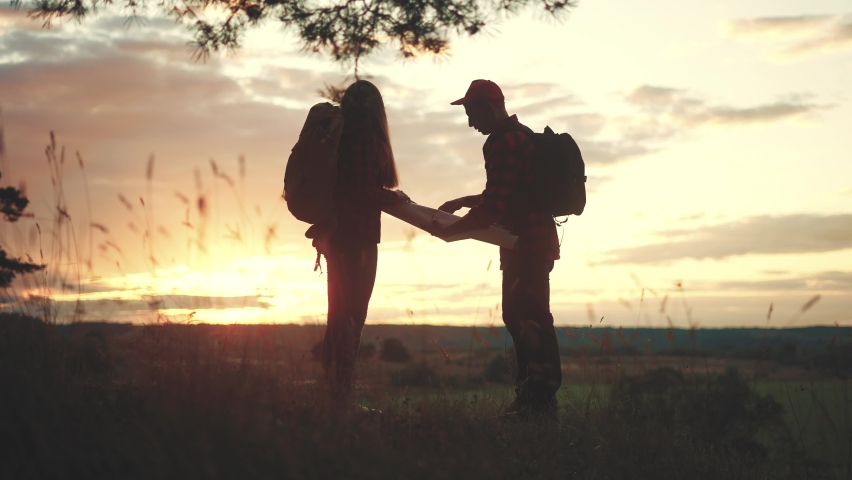 hiker group. team of hikers with backpacks silhouette with map the forest. nature travel a adventure concept. lifestyle hiker group with backpacks with map on the sunset. mountain outdoor view Royalty-Free Stock Footage #1094485907
