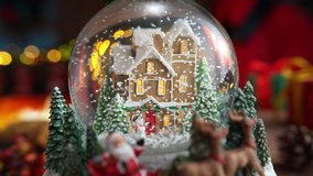 Christmas Snow Globe with Snow Falling in Slow Motion and Burning Fireplace in the Background - Vertigo Effect - Powered by Shutterstock - Get 15% off with code: PIKWIZARD15
