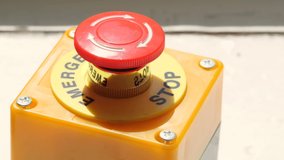 Man pushing forcefully hitting a red industrial machine emergency stop button, object detail, closeup. Industry workplace safety, work place accidents simple abstract concept. Accidents at work - Powered by Shutterstock - Get 15% off with code: PIKWIZARD15