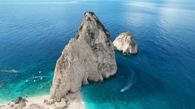 Aerial view of Zakynthos Greece Limni Keri rock island. Sunrise. Mizithres limestone formation in sea. Myzithres, Europe, Ionian sea. Turquoise clear blue water with white sands and green cliffs