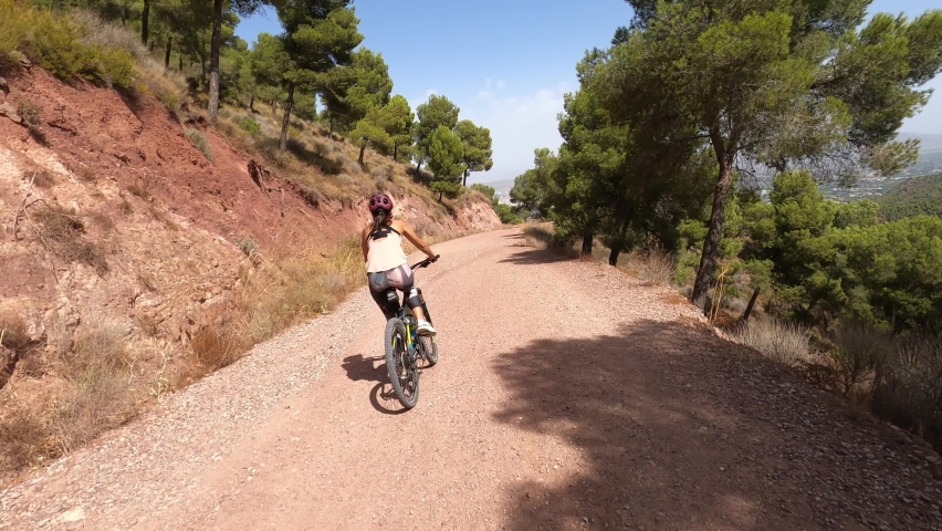 Mountain bike at the top of the hill. Couple of sports person reach the top.  | Shutterstock HD Video #1094494677