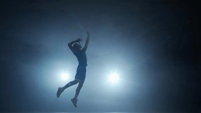 Slow motion, volleyball player hits the ball towards the opponents, contour lighting. - Powered by Shutterstock - Get 15% off with code: PIKWIZARD15