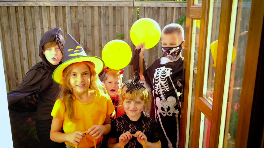Children are celebrating Halloween in costumes. Selective focus. Kids. Royalty-Free Stock Footage #1094519883