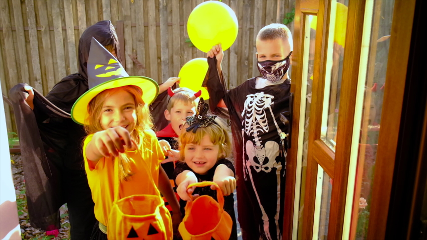 Children are celebrating Halloween in costumes. Selective focus. Kids. | Shutterstock HD Video #1094519883